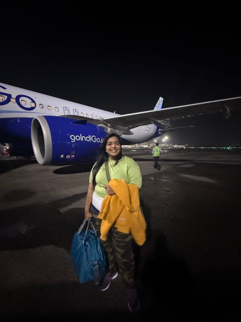 Dr. Nuzhat Jahan beside an IndiGo aircraft